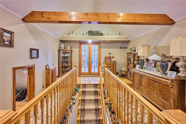 hallway with french doors and lofted ceiling with beams