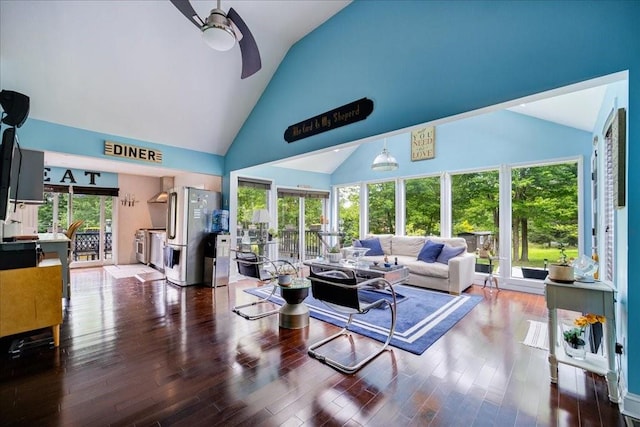 interior space featuring plenty of natural light, ceiling fan, and vaulted ceiling