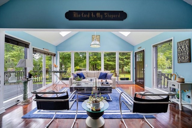 sunroom / solarium with lofted ceiling with skylight