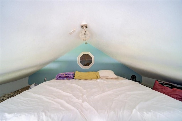 bedroom featuring vaulted ceiling