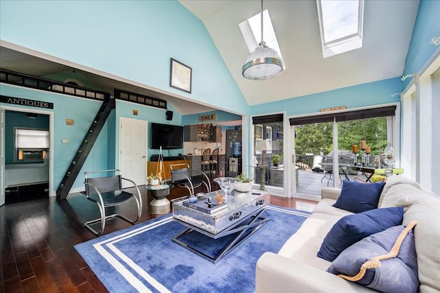 living room with a skylight, dark hardwood / wood-style flooring, and high vaulted ceiling