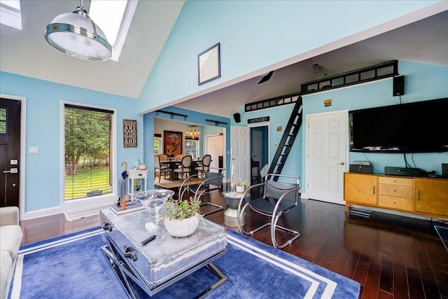 living room featuring high vaulted ceiling and dark hardwood / wood-style floors