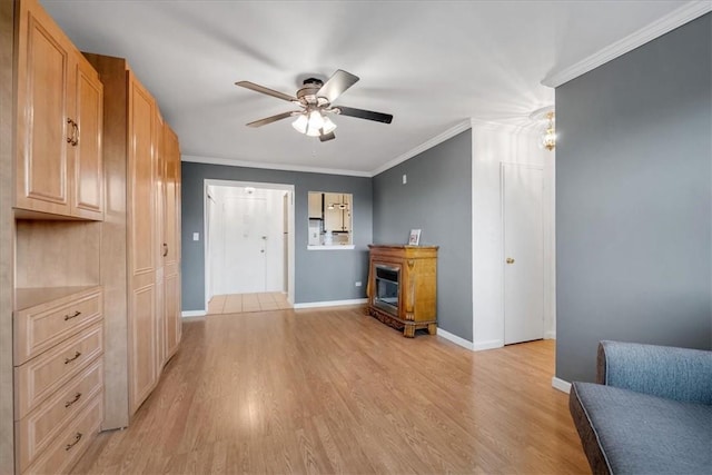 living room with light wood-type flooring, ceiling fan, and ornamental molding