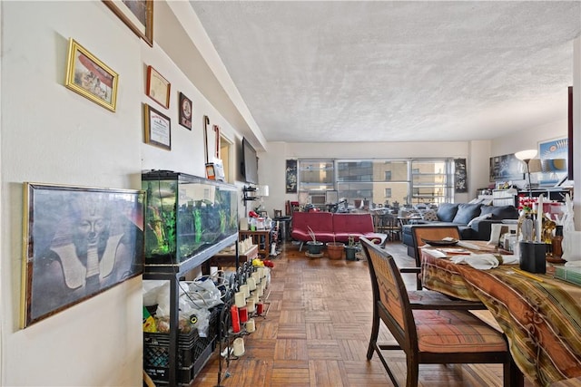 dining area featuring parquet floors and a textured ceiling