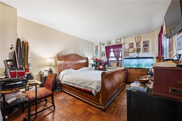 bedroom featuring dark parquet floors