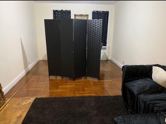 interior space featuring parquet flooring and ornamental molding