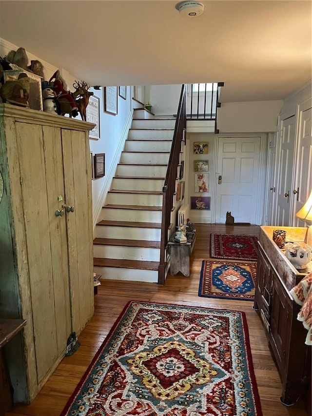 staircase featuring hardwood / wood-style floors