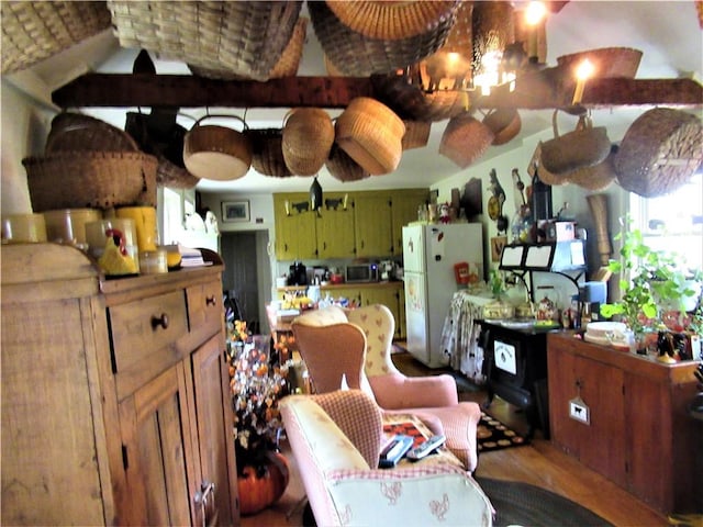 kitchen with hardwood / wood-style flooring and white refrigerator