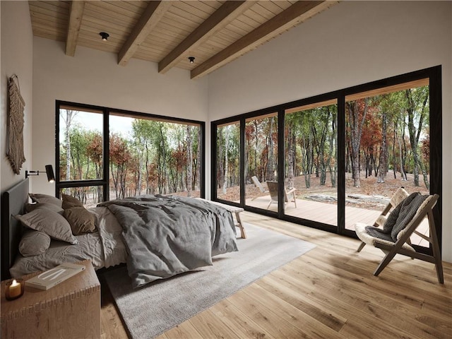 bedroom featuring access to outside, multiple windows, hardwood / wood-style floors, and wooden ceiling