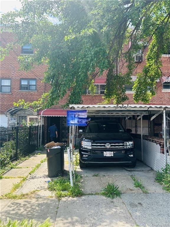 view of vehicle parking with a carport