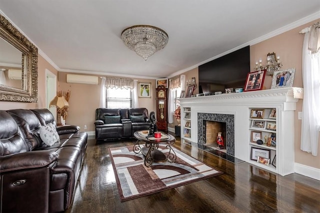 living room with hardwood / wood-style floors, a wall unit AC, ornamental molding, and a premium fireplace