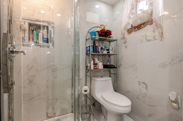 bathroom with walk in shower, toilet, and tile walls