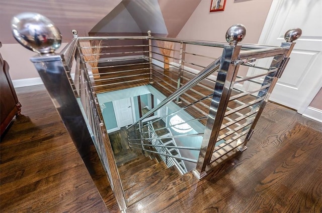 stairs with hardwood / wood-style flooring