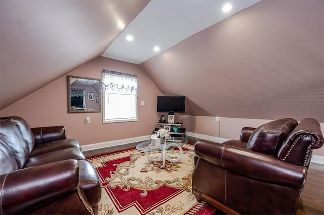 living room with wood-type flooring and lofted ceiling