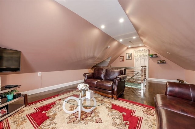 living room with wood-type flooring and vaulted ceiling