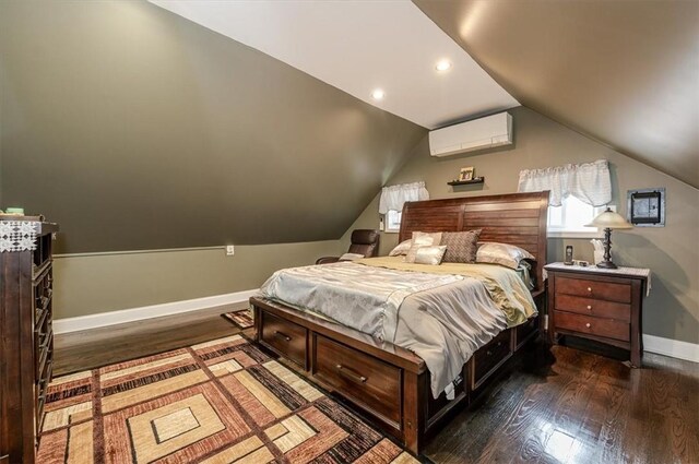 bedroom with vaulted ceiling, a wall mounted AC, and dark hardwood / wood-style floors