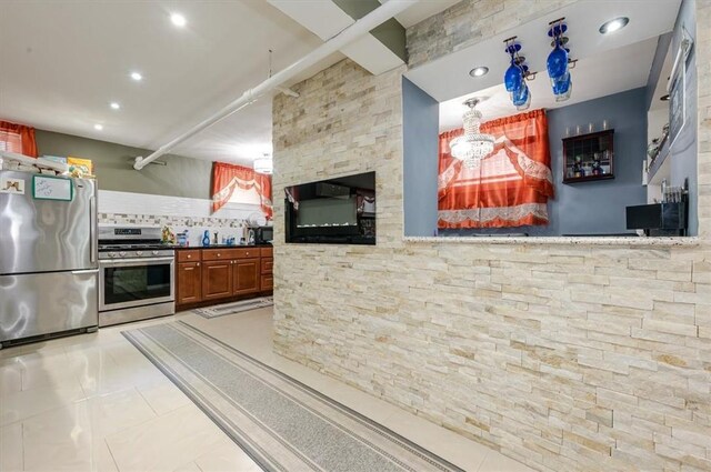 kitchen with tasteful backsplash, light tile patterned floors, stainless steel appliances, and beam ceiling