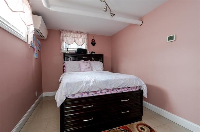 bedroom with a wall unit AC, light tile patterned flooring, and vaulted ceiling