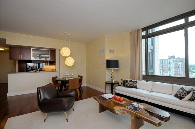 175 Huguenot St Unit 1607, New Rochelle, NY 10801 - living area with wood finished floors and baseboards