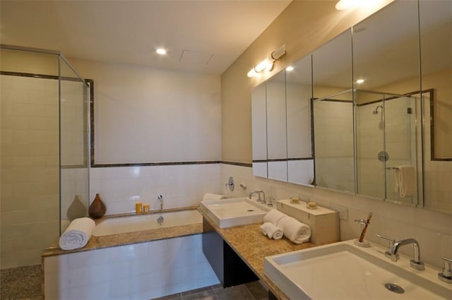 175 Huguenot St Unit 1607, New Rochelle, NY 10801 - full bathroom with tile walls, a bath, tiled shower, double vanity, and tasteful backsplash