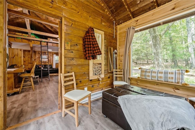 sunroom / solarium with a healthy amount of sunlight and vaulted ceiling