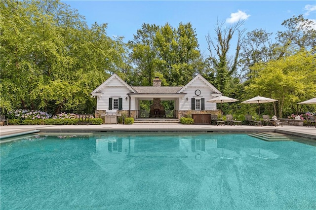 view of swimming pool with a patio