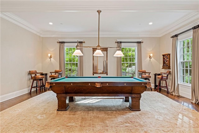 recreation room with a wealth of natural light, ornamental molding, hardwood / wood-style flooring, and pool table