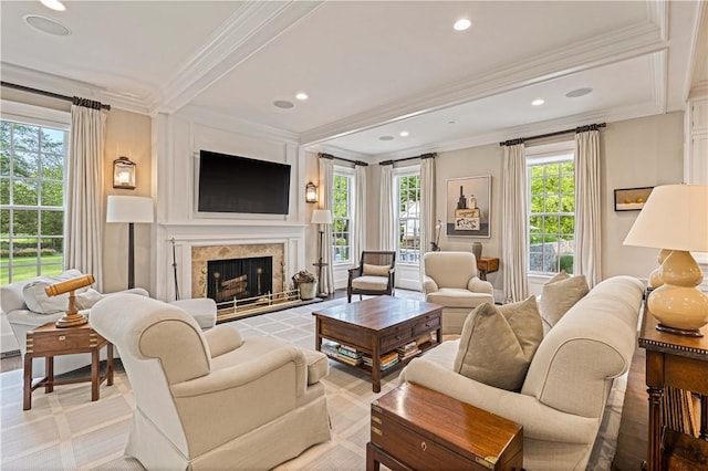 living room featuring crown molding and a high end fireplace