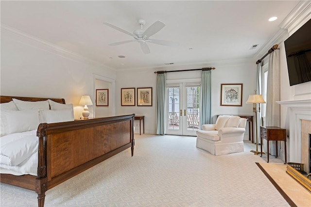 bedroom with french doors, access to outside, ceiling fan, crown molding, and a fireplace