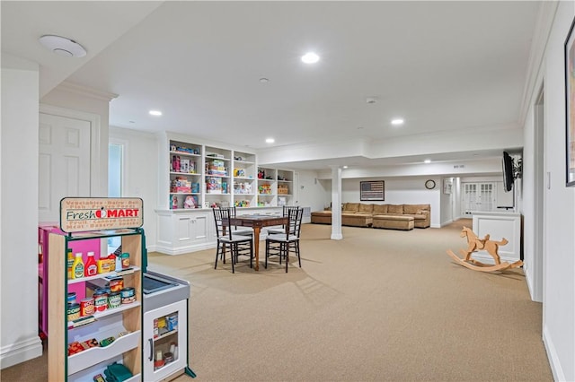 recreation room featuring light colored carpet and ornamental molding