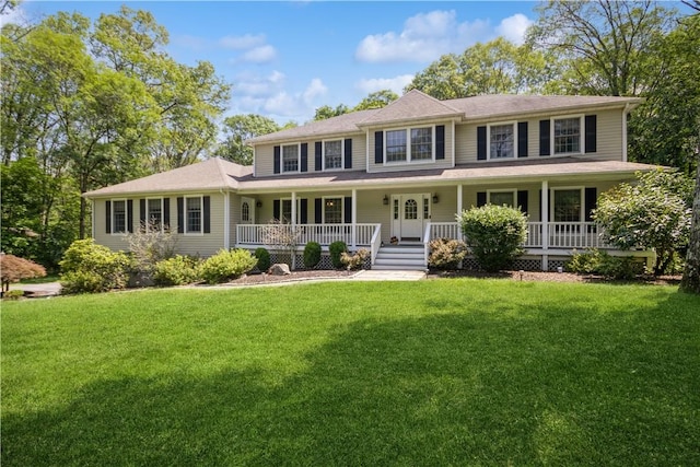 view of front of home featuring a front lawn and covered porch