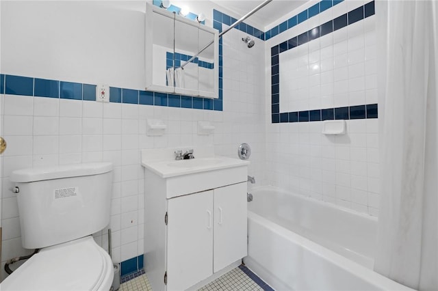 full bathroom with tile patterned flooring, shower / bath combination with curtain, tile walls, and toilet