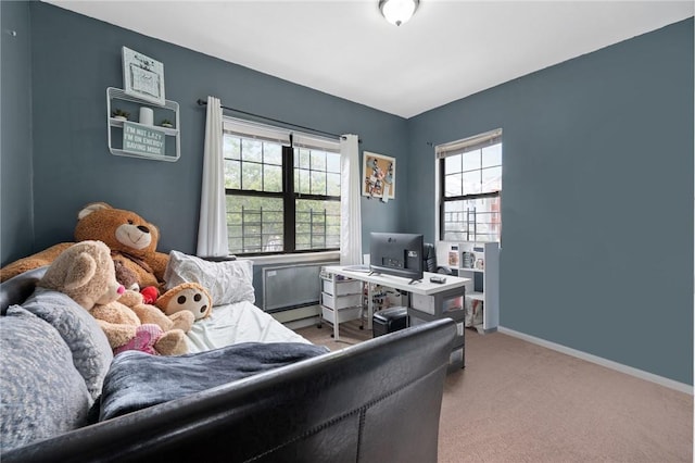 bedroom featuring light colored carpet and a baseboard radiator