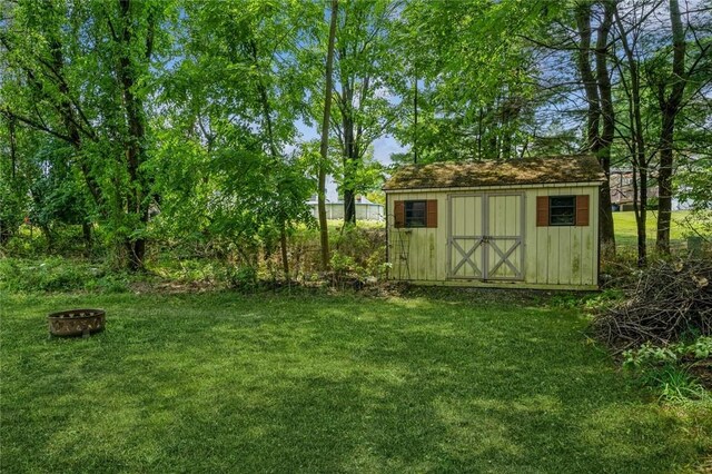 view of shed featuring a fire pit