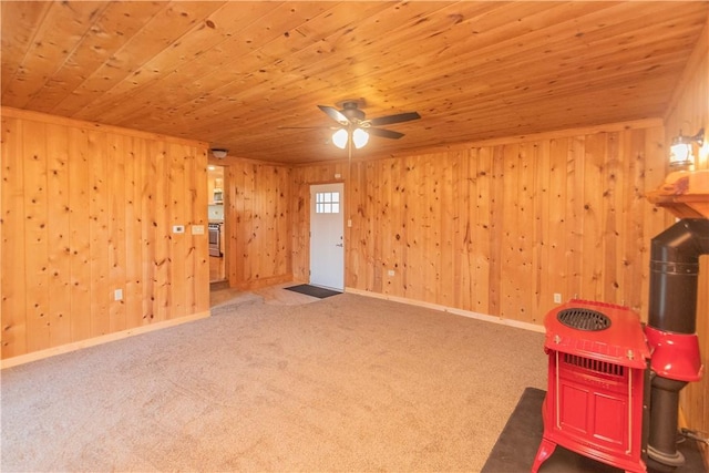 interior space with wooden walls, carpet, and wood ceiling