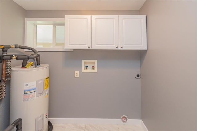 clothes washing area featuring electric dryer hookup, cabinets, hookup for a washing machine, water heater, and light tile patterned flooring