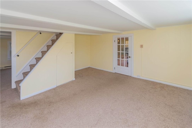 basement with carpet floors and a baseboard heating unit