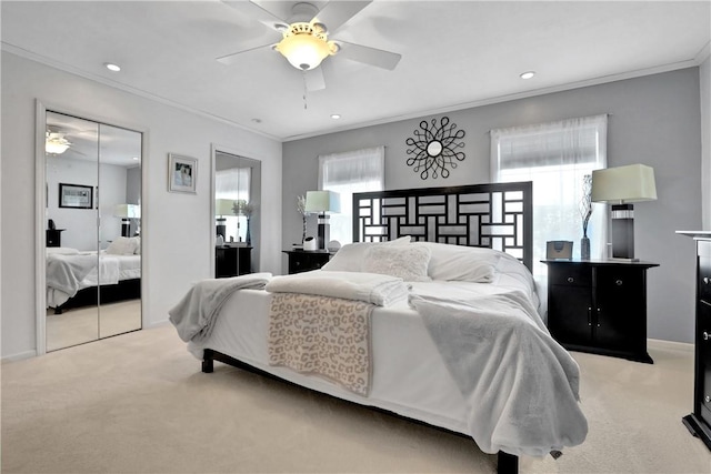 bedroom featuring light carpet, ceiling fan, and crown molding