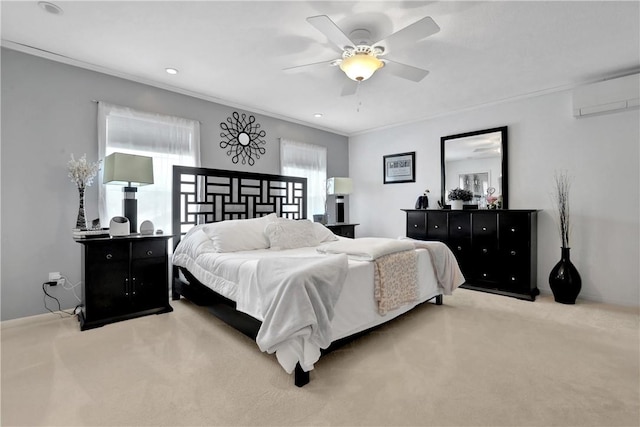 carpeted bedroom with ceiling fan, crown molding, and a wall mounted AC