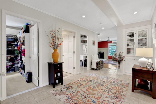 living room with crown molding and light tile patterned flooring