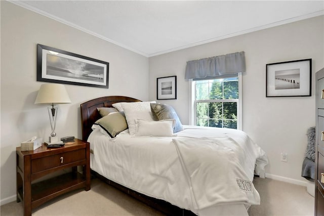 carpeted bedroom with ornamental molding