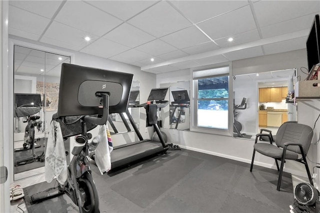 workout area featuring a paneled ceiling