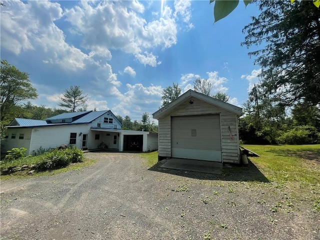 garage featuring a lawn