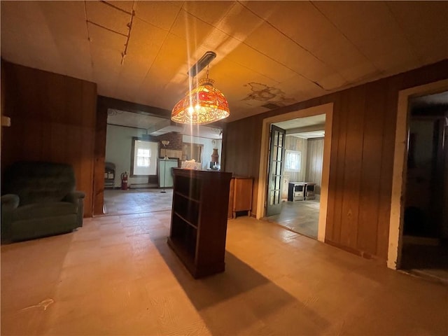 dining space featuring wooden walls