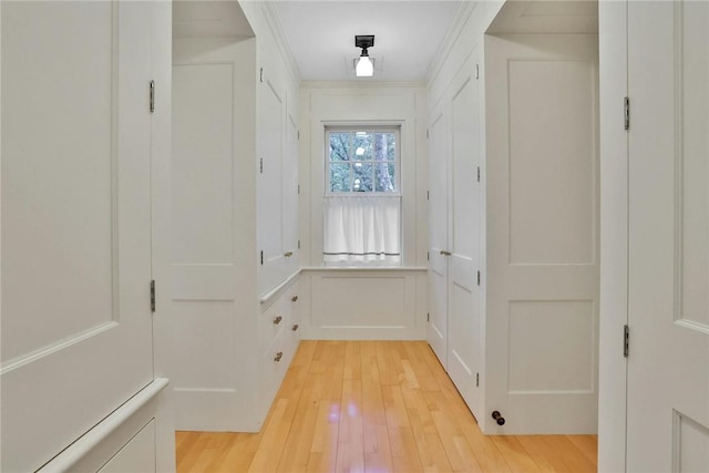 mudroom featuring light hardwood / wood-style floors and crown molding