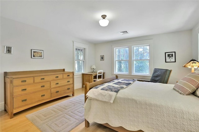 bedroom featuring light wood-type flooring