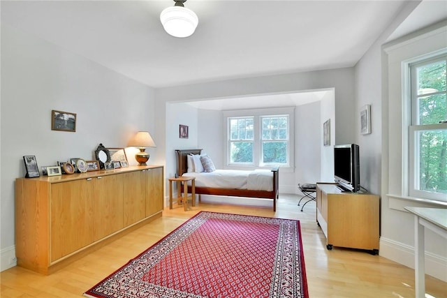 bedroom with light wood-type flooring