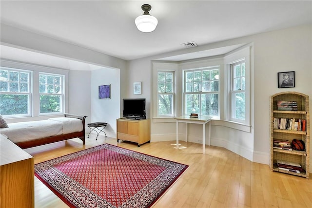 bedroom with hardwood / wood-style floors