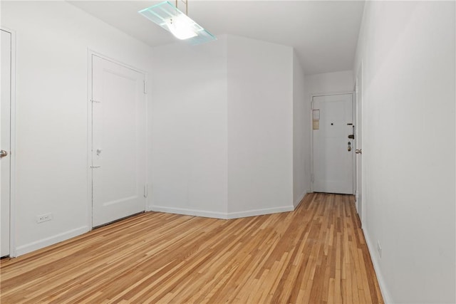 spare room with light hardwood / wood-style floors