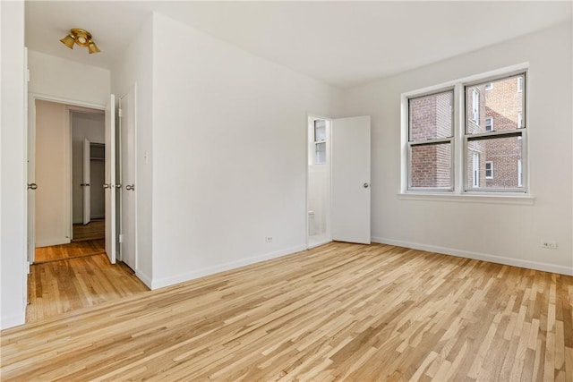 unfurnished room with light hardwood / wood-style floors